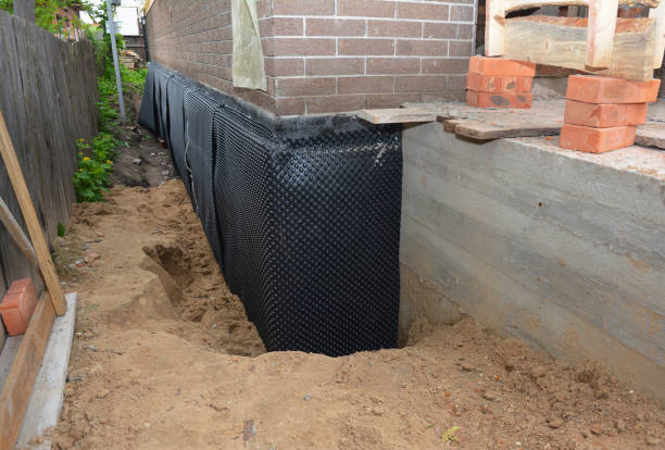 Happy homeowners after waterproofing job in Port William
